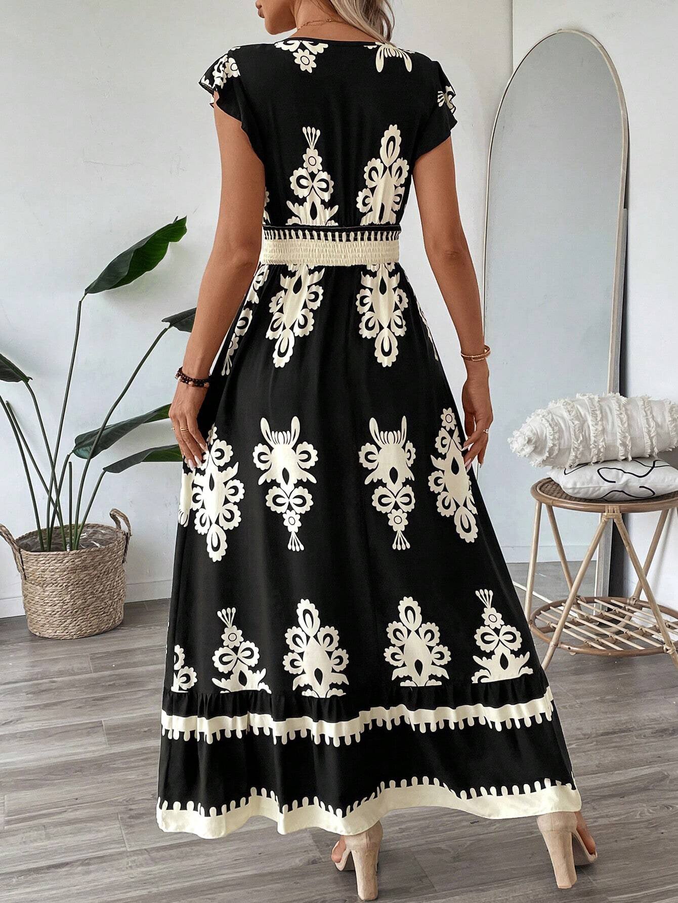 Vestito maxi nero con ricamo etnico avorio e gonna a balze