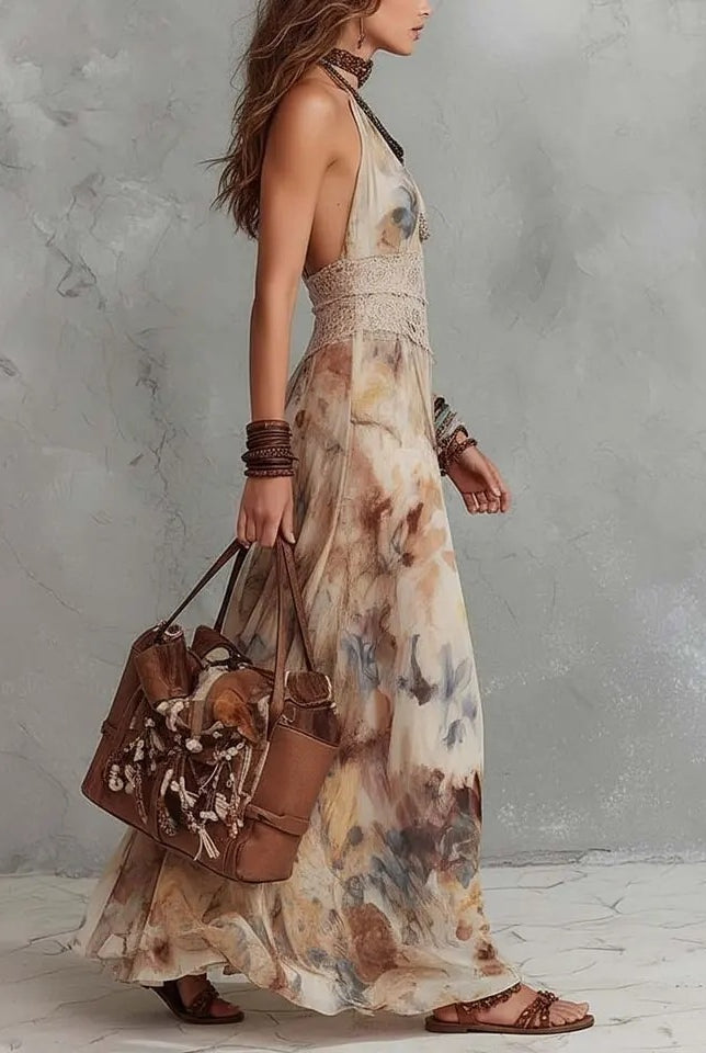 Vestito Aurora visto di fronte: corpetto con scollo all'americana e gonna lunga fluida a stampa floreale