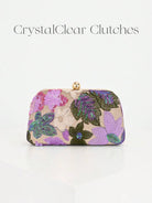 Pochette a mezzaluna con fantasia floreale viola e lilla e catena dorata