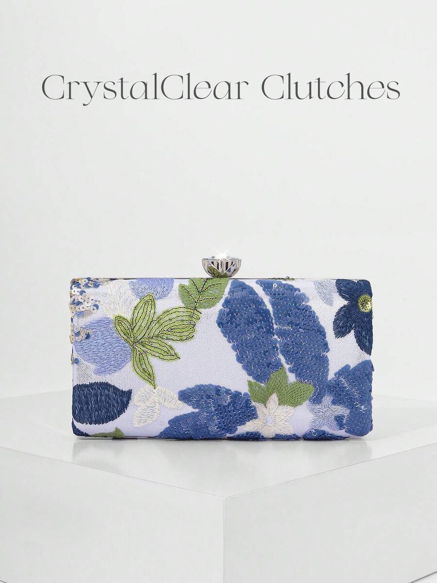Clutch rigida con fiori blu su fondo avorio e catena dorata