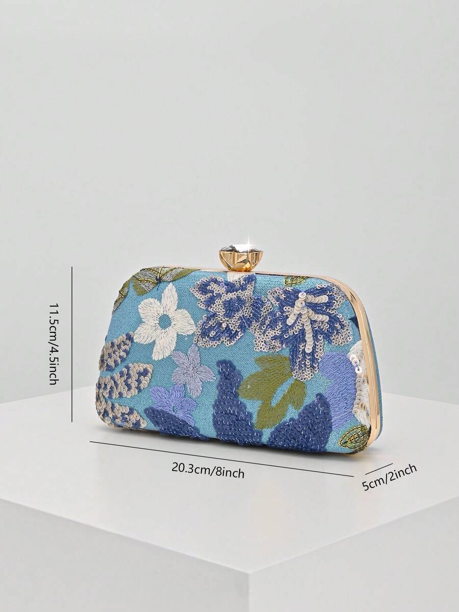 Montatura dorata con chiusura a scatto della pochette blu