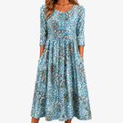 Abito maxi con stampa botanica nei toni chiari e tasche laterali