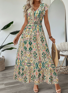 Vestito maxi con stampa paisley verde, scollo a V e maniche ad aletta