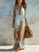 Vestito maxi con stampa paisley azzurra, scollo a V e manica lunga