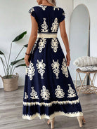 Vestito maxi blu con ricamo etnico avorio e gonna a balze