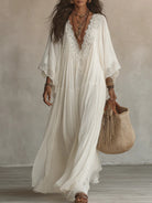 Abito maxi boho con maniche larghe e ricami - colore bianco | Bella di Roma