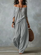 Completo due pezzi grigio con top a spalle scoperte e pantaloni ampi