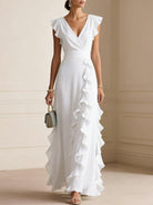 Abito maxi elegante bianco con volant a cascata e scollo a V - Bella di Roma