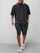 Set sportivo uomo nero in cotone – t-shirt e shorts | Bella di Roma