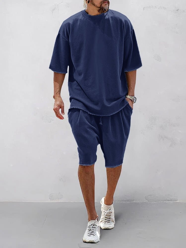 Set sportivo uomo blu navy in cotone – t-shirt e shorts | Bella di Roma