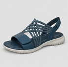 Sandali comfort da donna in blu visti di lato, con cinturino posteriore regolabile e suola antiscivolo