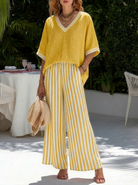 Completo due pezzi giallo a righe in cotone e lino